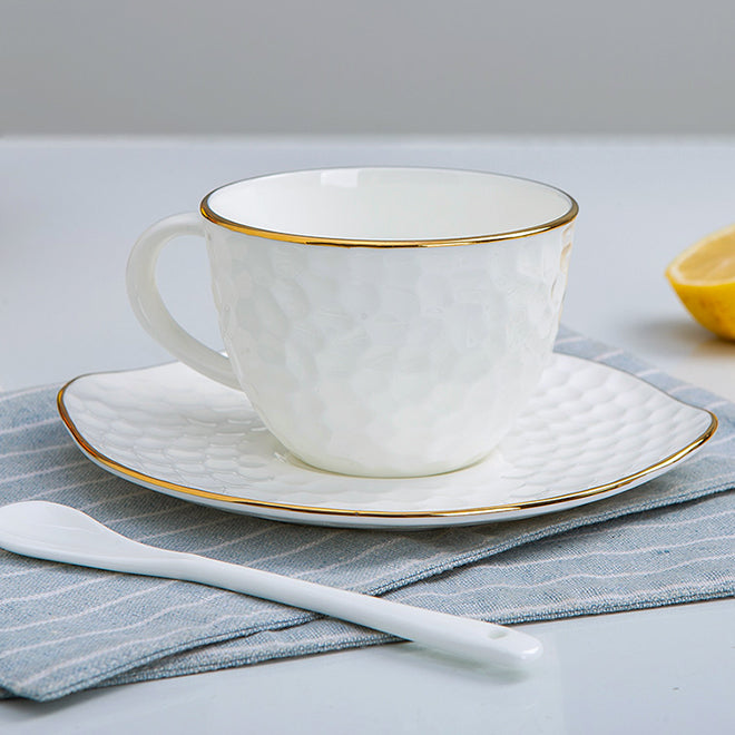 Bone China Tea Cup & Saucer - Gold Rimmed on Golf Shaped Surface