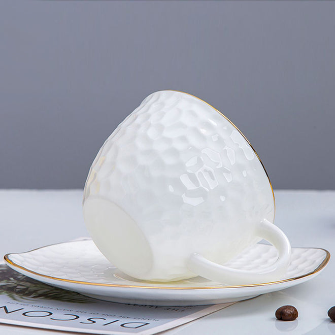 Bone China Tea Cup & Saucer - Gold Rimmed on Golf Shaped Surface