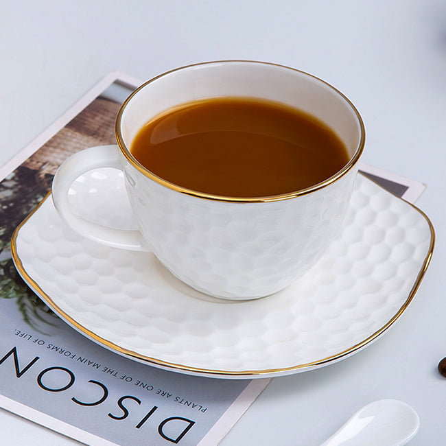Bone China Tea Cup & Saucer - Gold Rimmed on Golf Shaped Surface