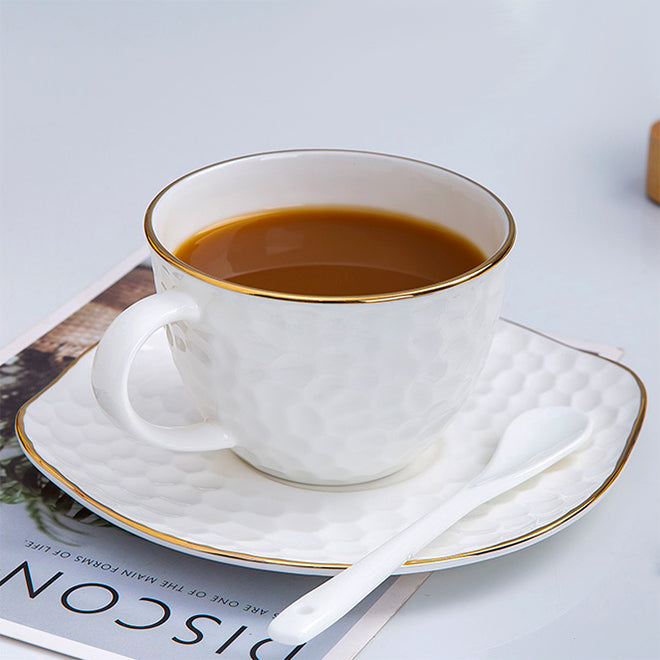 Bone China Tea Cup & Saucer - Gold Rimmed on Golf Shaped Surface